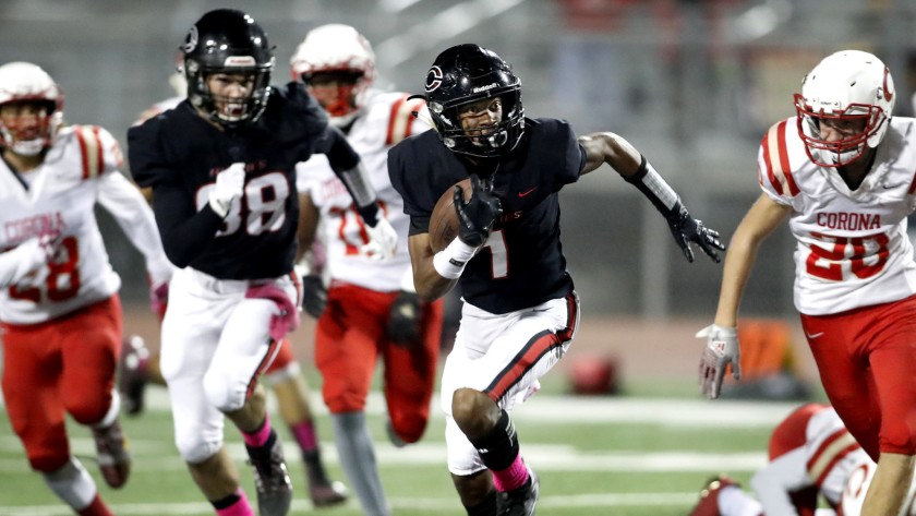 Corona Centennial wide receiver Gary Bryant evades Corona defenders for a touchdown in 2017.